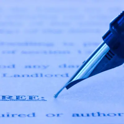 fountain pen and printed agreement